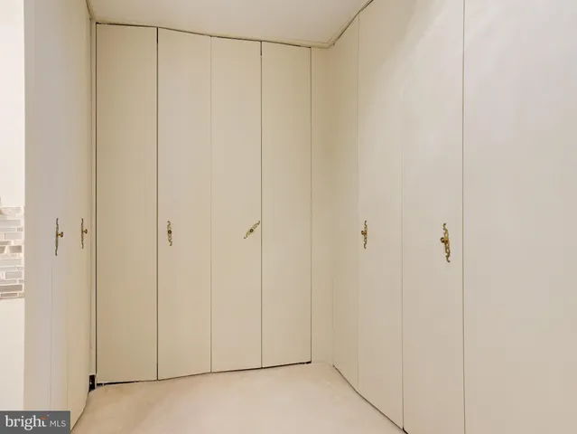 a kitchen with stainless steel appliances granite countertop a stove and a refrigerator
