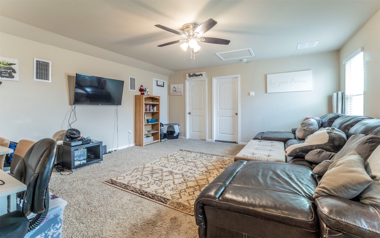1714 Deodara Drive Cedar Park, TX 78613 - Photo 20 of 37 a living room with furniture and a flat screen tv