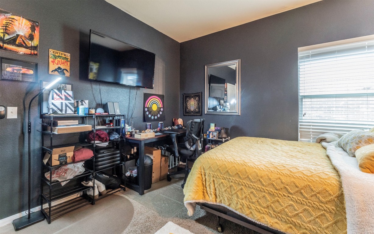 1714 Deodara Drive Cedar Park, TX 78613 - Photo 30 of 37 a bed room with a bed and a flat screen tv