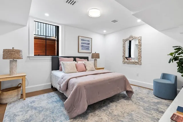 a bedroom with a bed and a couch