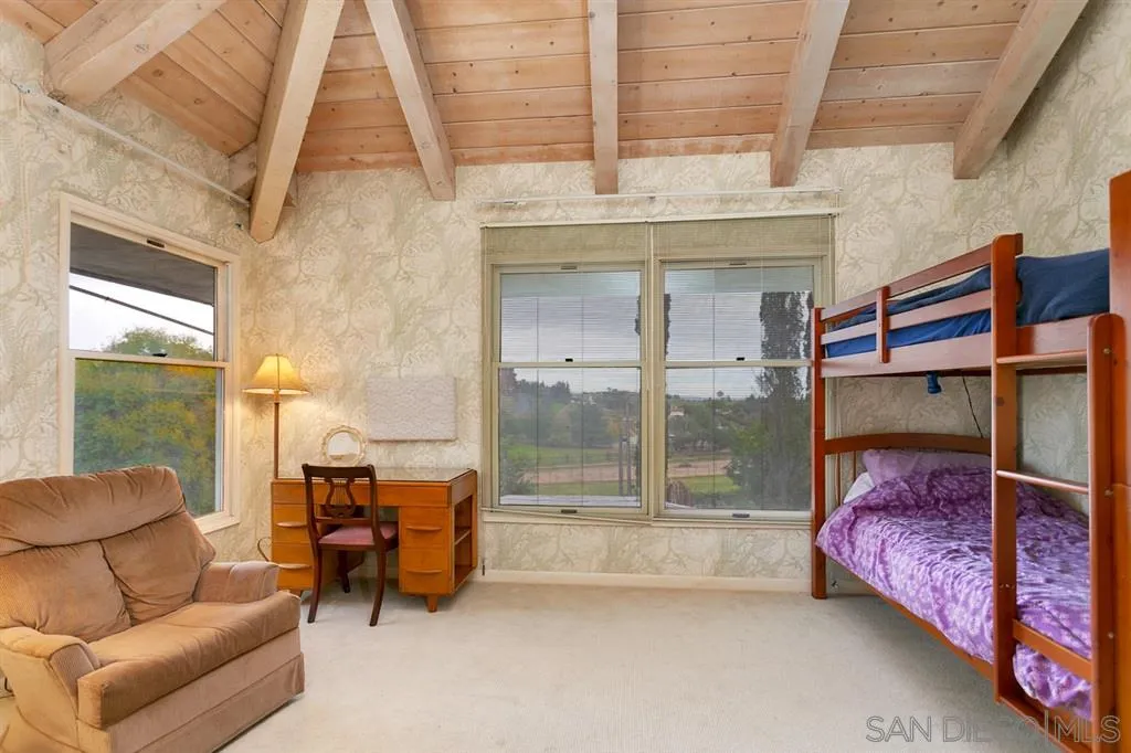 1154 Capra Way Fallbrook, CA 92028 - Photo 20 of 25 a bedroom with furniture and a window