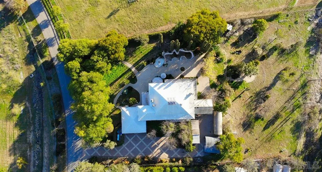 1154 Capra Way Fallbrook, CA 92028 - Photo 4 of 25 an aerial view of a house with a yard and garden