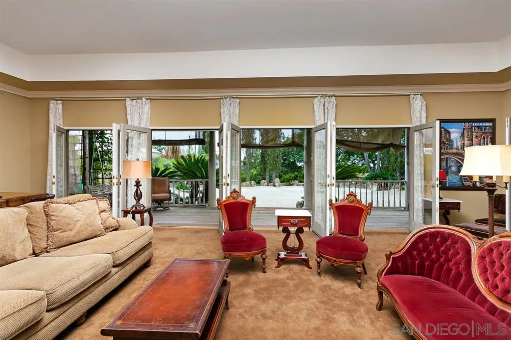 1154 Capra Way Fallbrook, CA 92028 - Photo 7 of 25 a living room with furniture and a large window