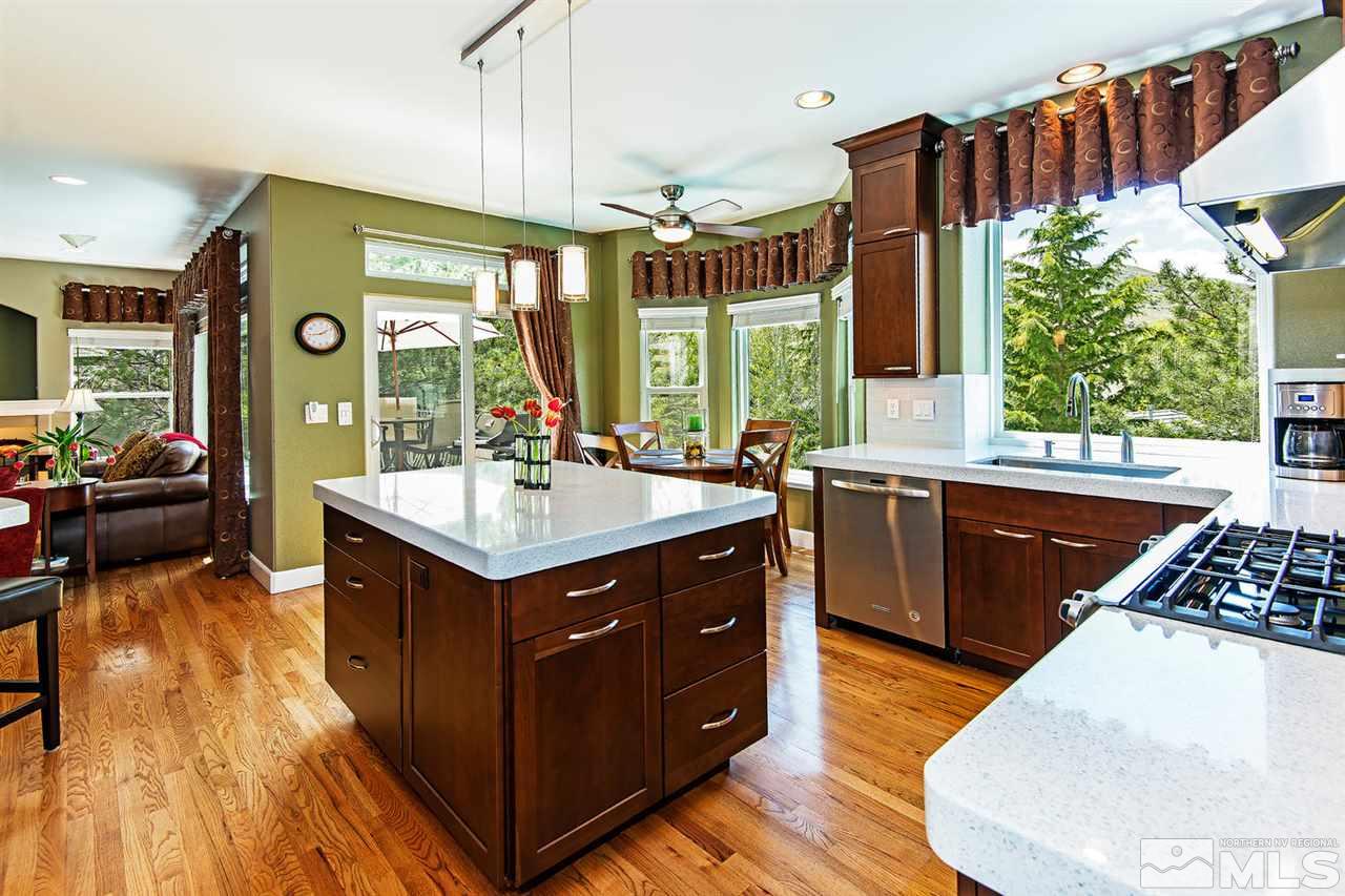 4870 East Creek Ridge Trail Reno, NV 89519 - Photo 13 of 25 a kitchen with a sink and a stove top oven