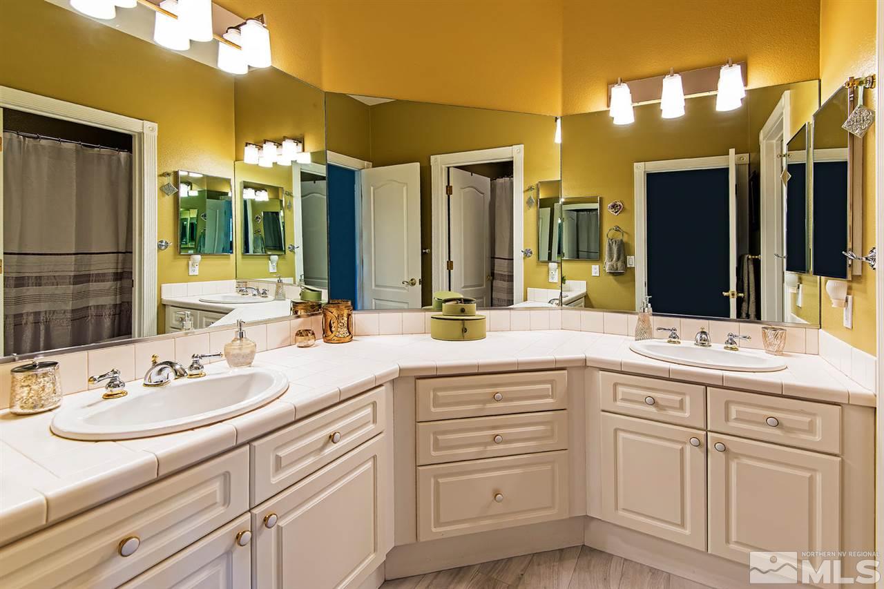 4870 East Creek Ridge Trail Reno, NV 89519 - Photo 22 of 25 a bathroom with a sink and a mirror