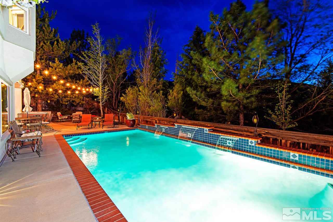 4870 East Creek Ridge Trail Reno, NV 89519 - Photo 7 of 25 a view of swimming pool with chairs