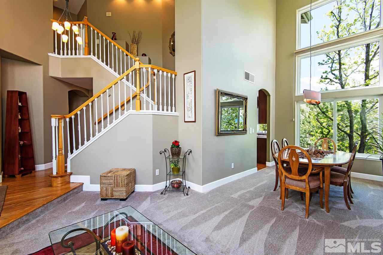 4870 East Creek Ridge Trail Reno, NV 89519 - Photo 8 of 25 a dining room with furniture entryway and wooden floor