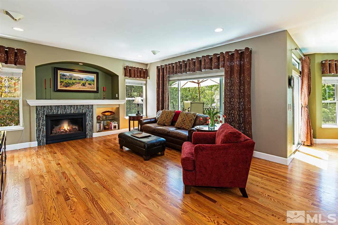 4870 East Creek Ridge Trail Reno, NV 89519 - Photo 10 of 25 a living room with furniture and a fireplace