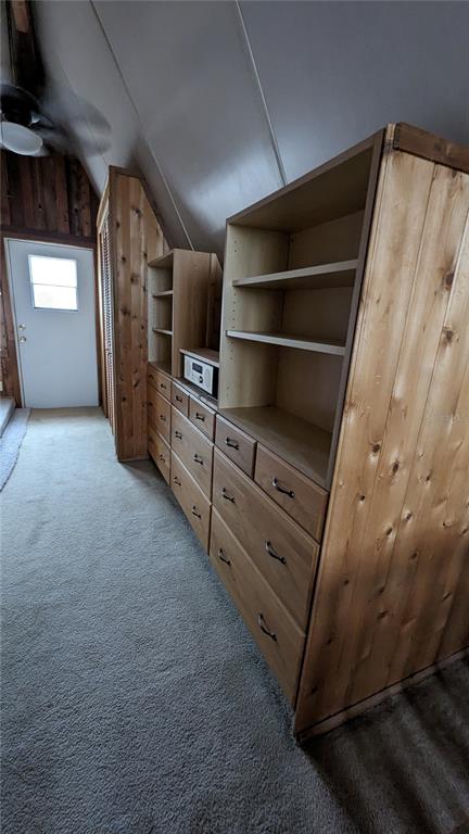 10301 Highway 27, Unit 17 Clermont, FL 34711 - Photo 12 of 19 a view of walk in closet with clothes and shoes