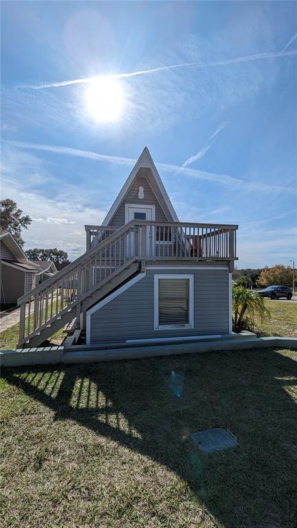 10301 Highway 27, Unit 17 Clermont, FL 34711 - Photo 2 of 19 a front view of a house with a yard