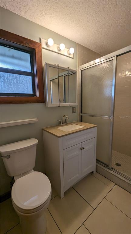 10301 Highway 27, Unit 17 Clermont, FL 34711 - Photo 8 of 19 a bathroom with a toilet sink and mirror