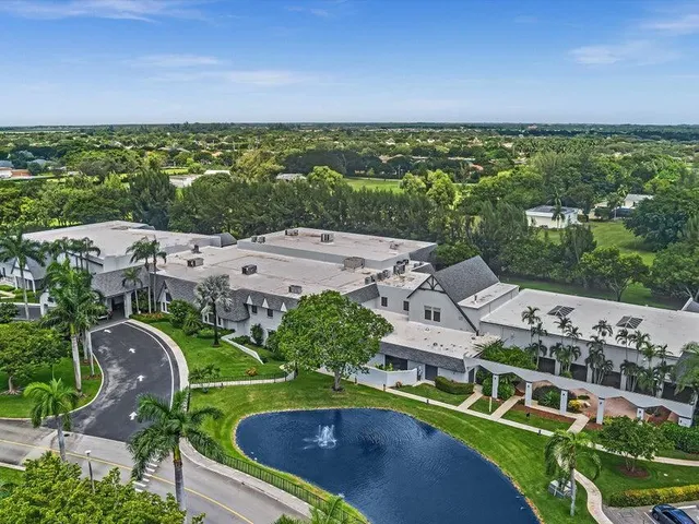a room with lots of chairs and mirrors