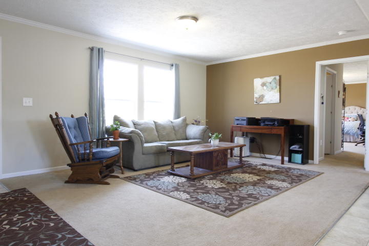 551 Merrimac Road Blacksburg, VA 24060 - Photo 11 of 12 a living room with furniture a fireplace and a table