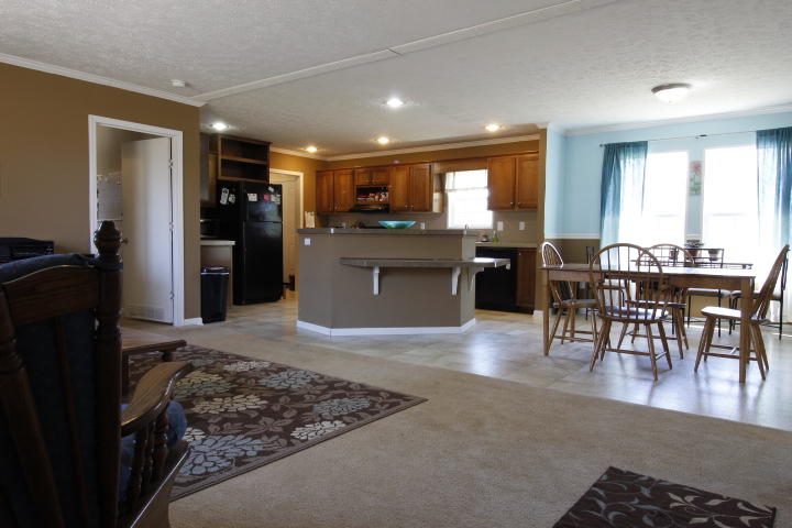 551 Merrimac Road Blacksburg, VA 24060 - Photo 12 of 12 a open kitchen with stainless steel appliances granite countertop a refrigerator a stove a sink a dining table and chairs with wooden floor
