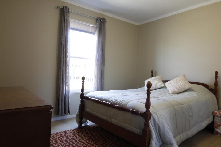 551 Merrimac Road Blacksburg, VA 24060 - Photo 10 of 12 a bedroom with a bed and wooden floor