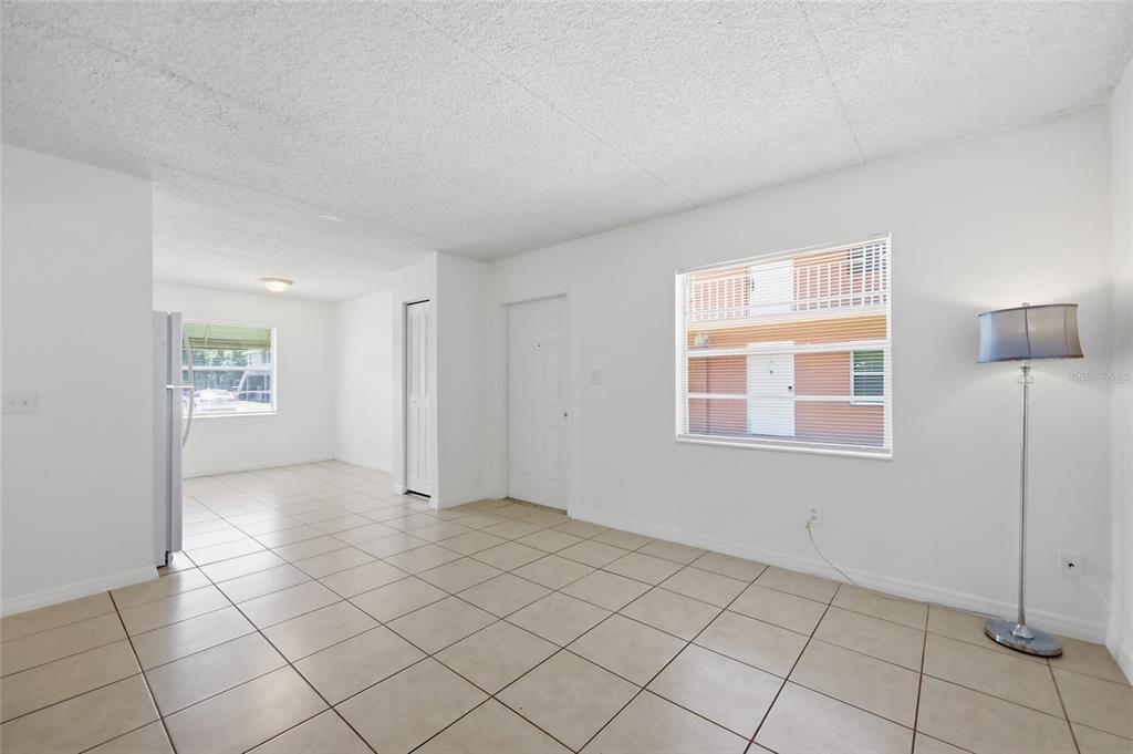 705 Michigan Court, Unit 14 St. Cloud, FL 34769 - Photo 11 of 45 a view of an empty room with window