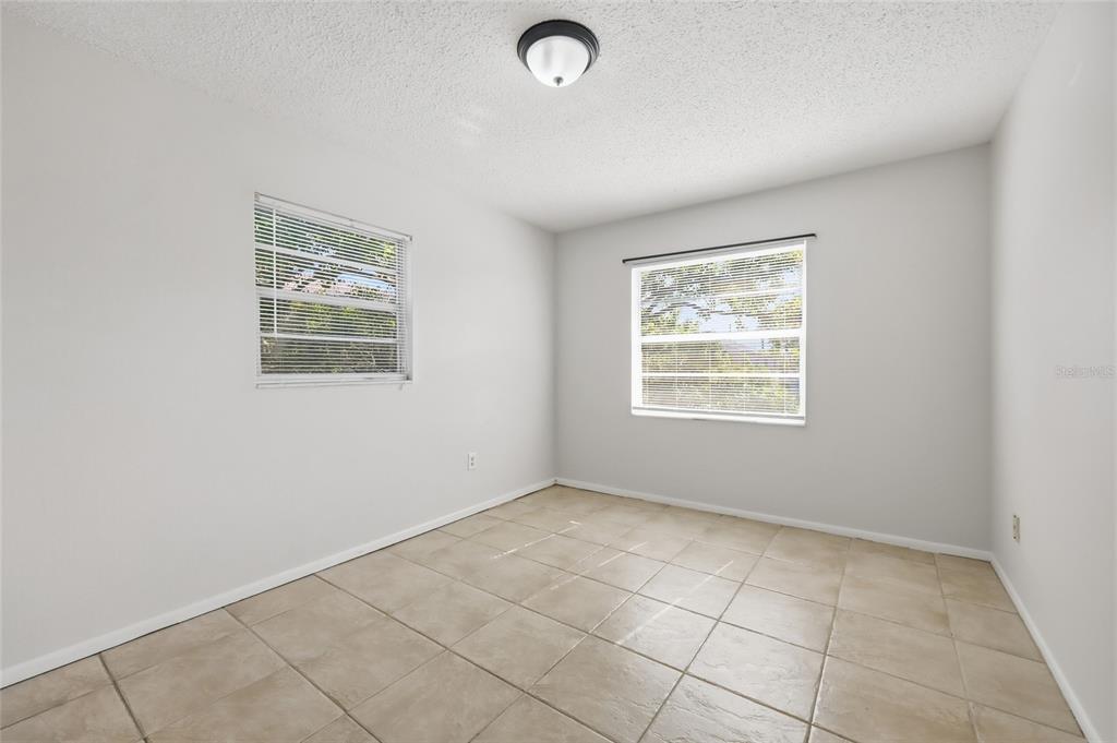 705 Michigan Court, Unit 14 St. Cloud, FL 34769 - Photo 30 of 45 an empty room with windows