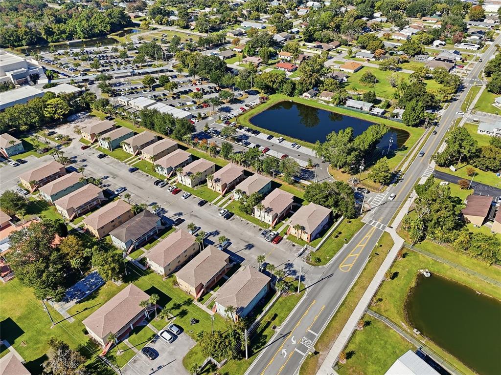 705 Michigan Court, Unit 14 St. Cloud, FL 34769 - Photo 36 of 45 an aerial view of residential houses with yard