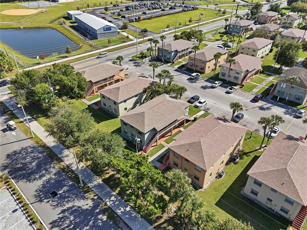705 Michigan Court, Unit 14 St. Cloud, FL 34769 - Photo 38 of 45 an aerial view of residential houses with outdoor space