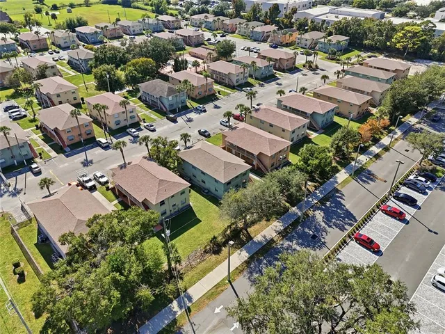 an aerial view of residential houses with outdoor space