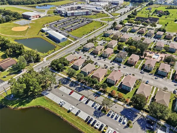 an aerial view of residential houses with outdoor space