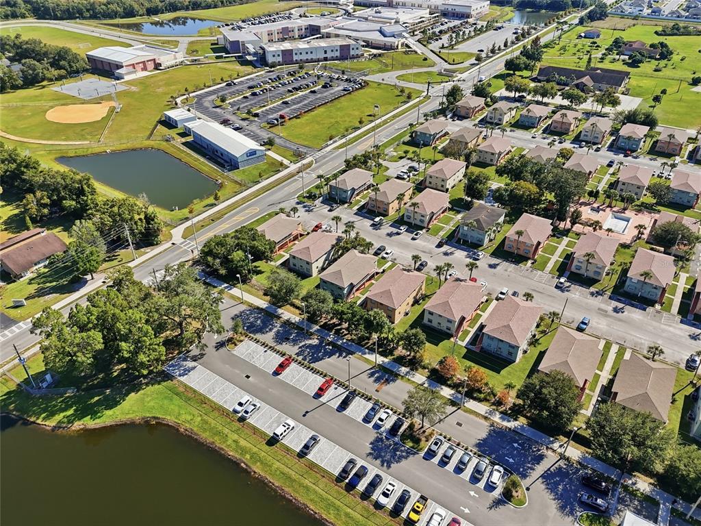 705 Michigan Court, Unit 14 St. Cloud, FL 34769 - Photo 41 of 45 an aerial view of residential houses with outdoor space