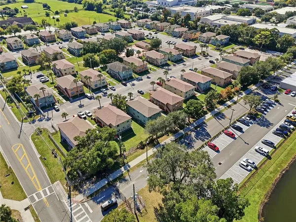 an aerial view of residential houses with outdoor space
