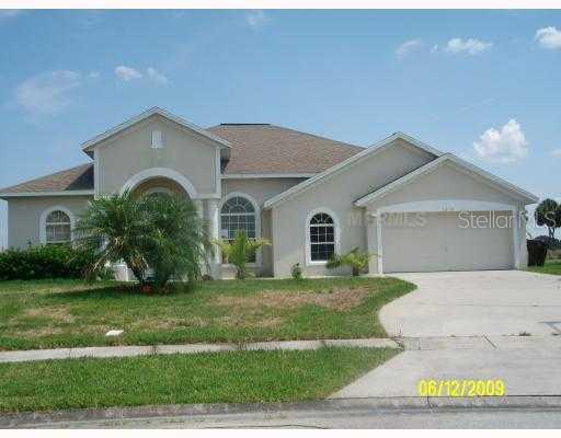 2620 Roughside Circle Kissimmee, FL 34746 - Photo 1 of 1 a front view of a house with a yard and garage