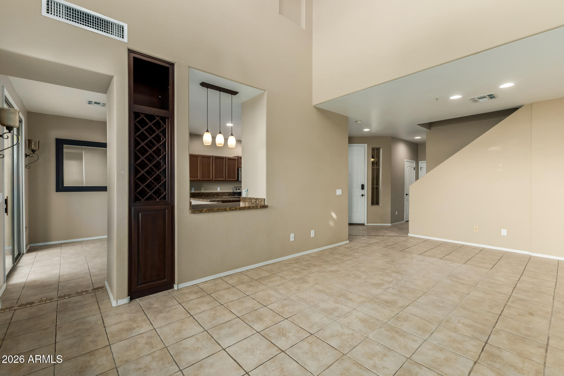 5415 East McKellips Road, Unit 106 Mesa, AZ 85215 - Photo 12 of 45 a view of a hallway with wooden shelves