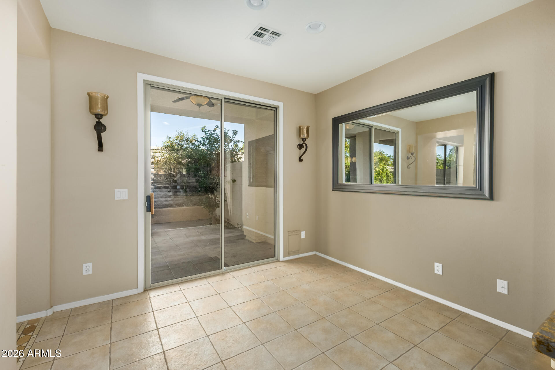 5415 East McKellips Road, Unit 106 Mesa, AZ 85215 - Photo 15 of 45 a view of an empty room with glass door