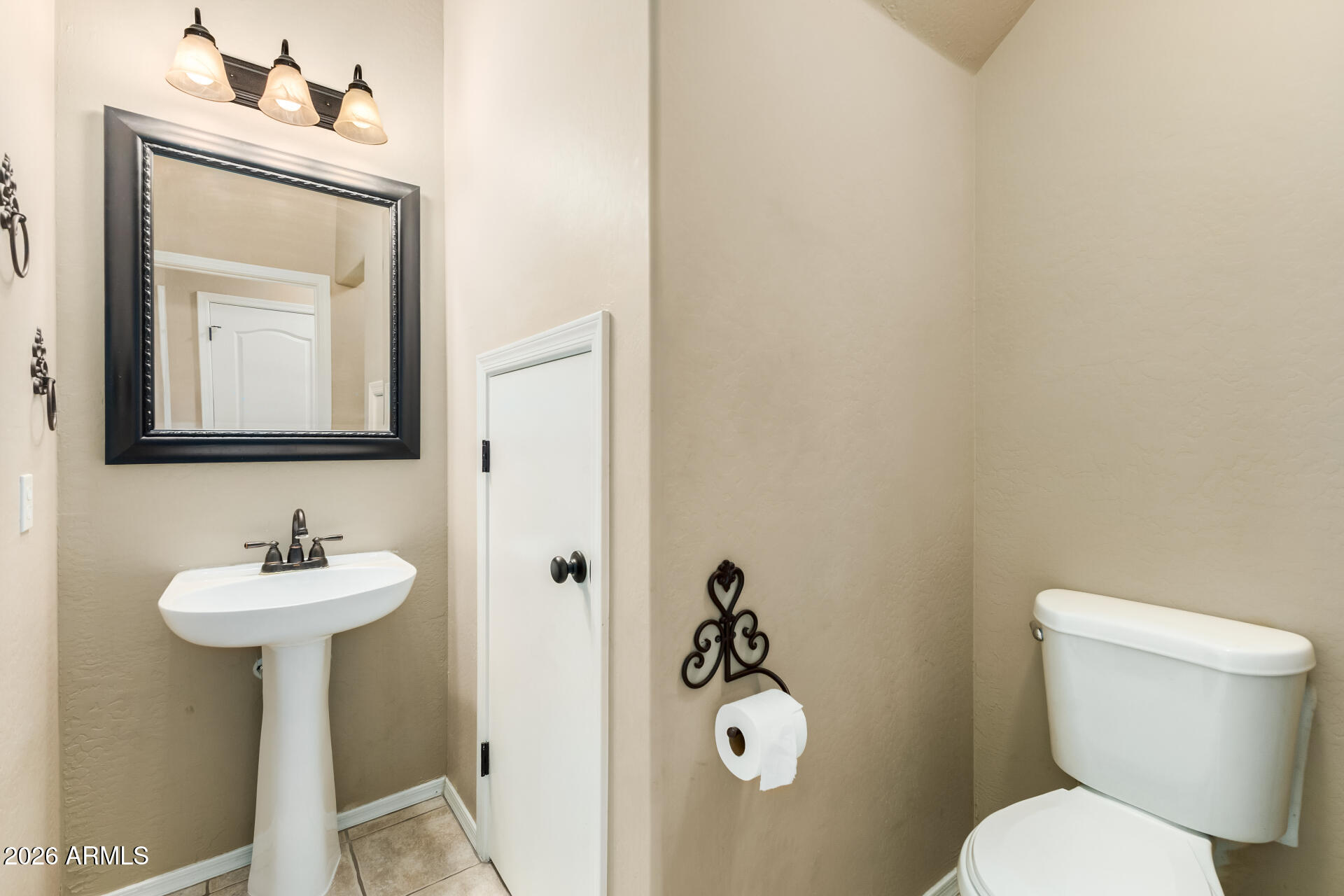 5415 East McKellips Road, Unit 106 Mesa, AZ 85215 - Photo 19 of 45 a bathroom with a toilet sink and mirror