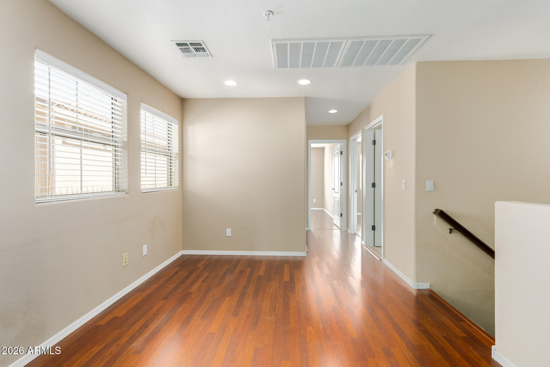 5415 East McKellips Road, Unit 106 Mesa, AZ 85215 - Photo 21 of 45 a view of a big room with wooden floor and windows