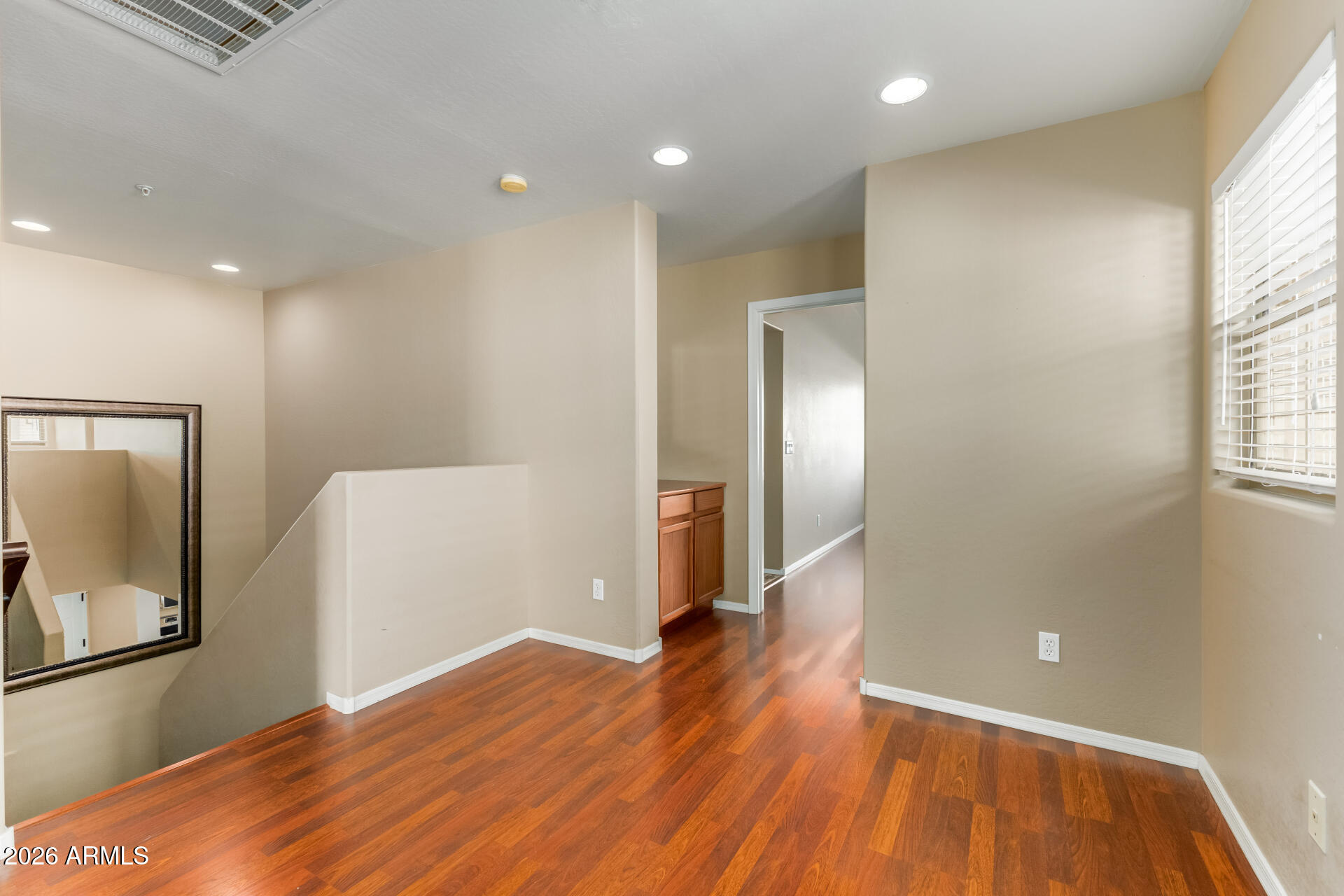 5415 East McKellips Road, Unit 106 Mesa, AZ 85215 - Photo 22 of 45 a view of a livingroom with wooden floor