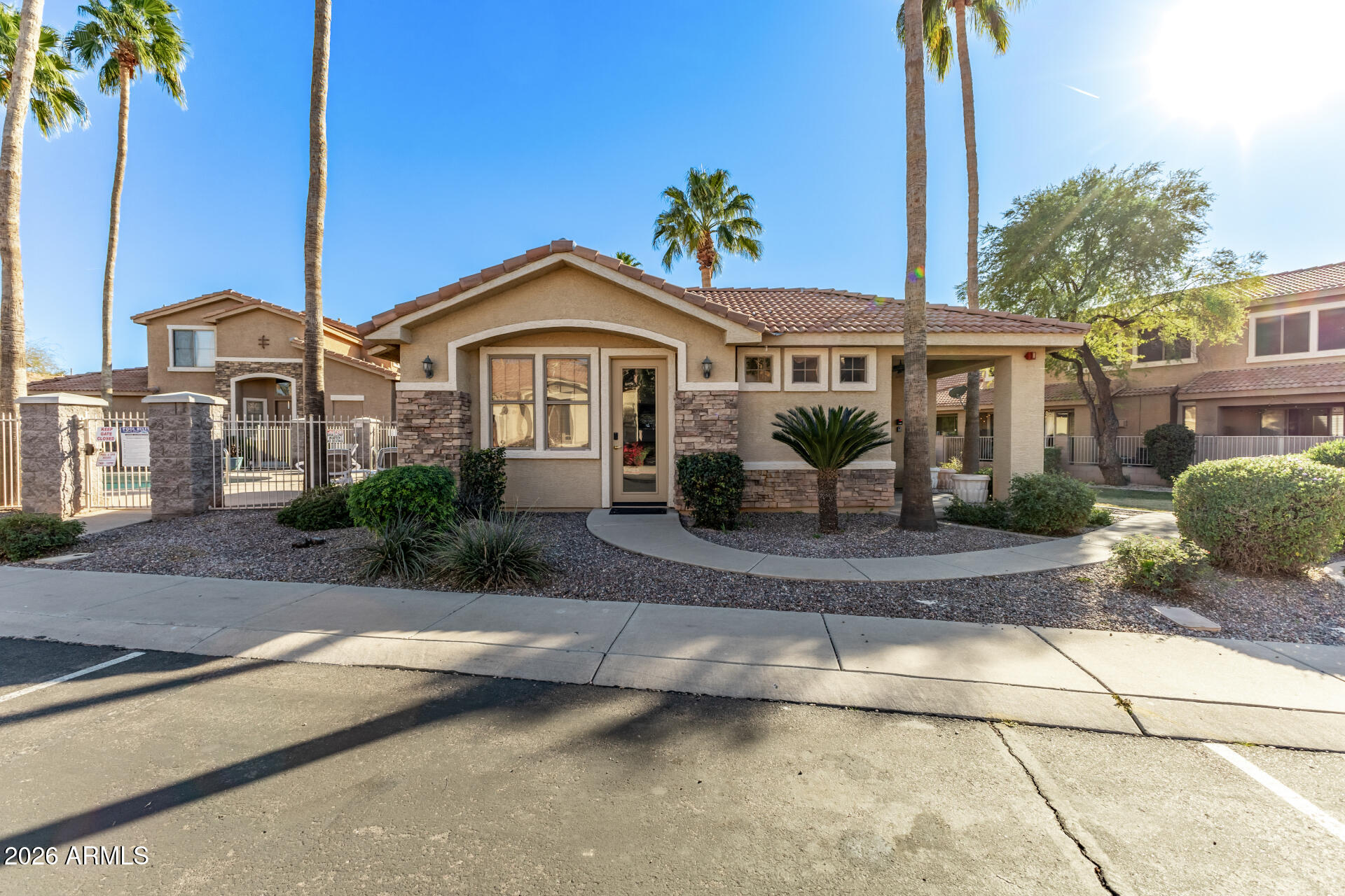 5415 East McKellips Road, Unit 106 Mesa, AZ 85215 - Photo 38 of 45 a front view of a house with a yard