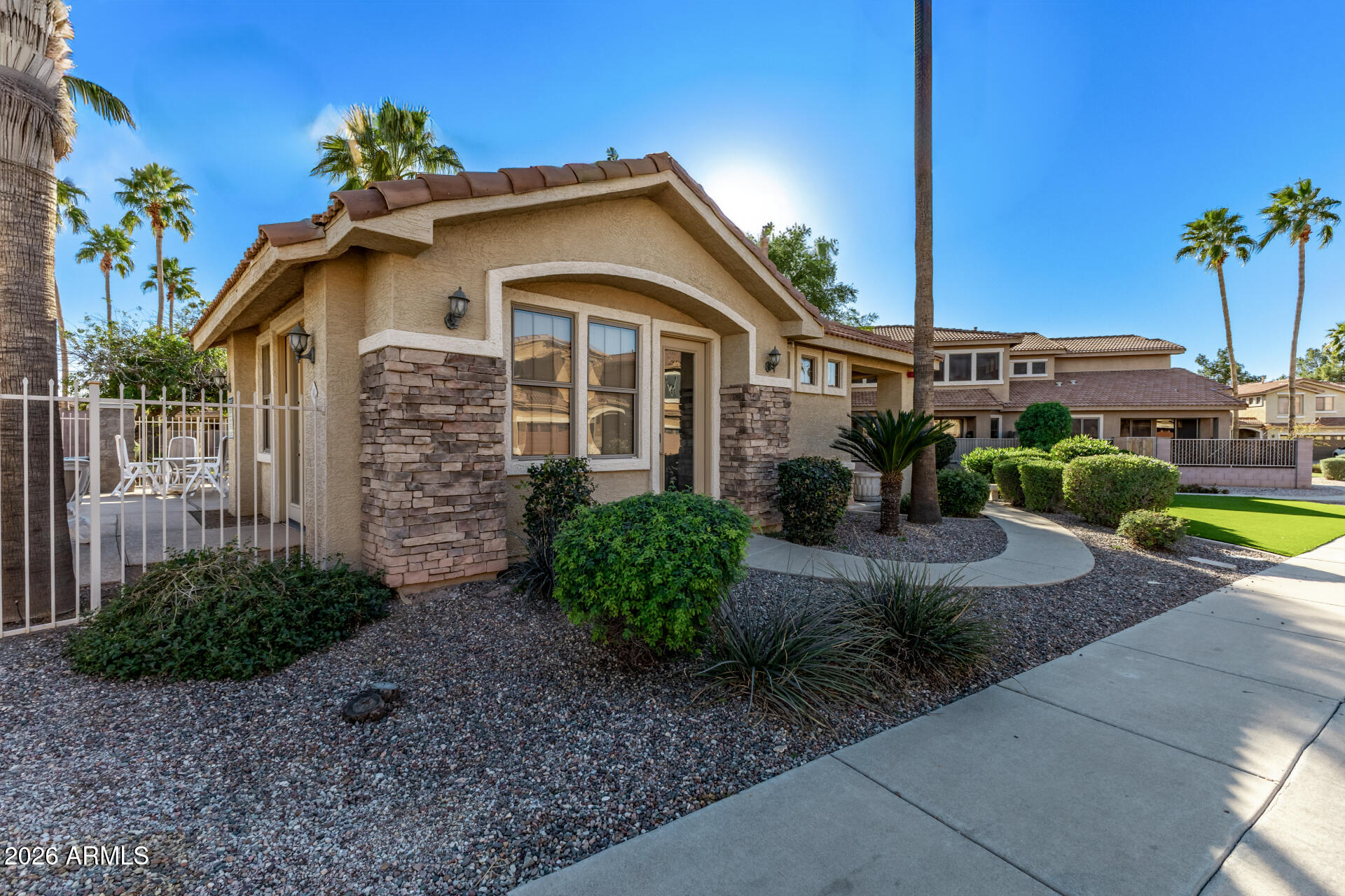 5415 East McKellips Road, Unit 106 Mesa, AZ 85215 - Photo 39 of 45 a front view of a house with garden