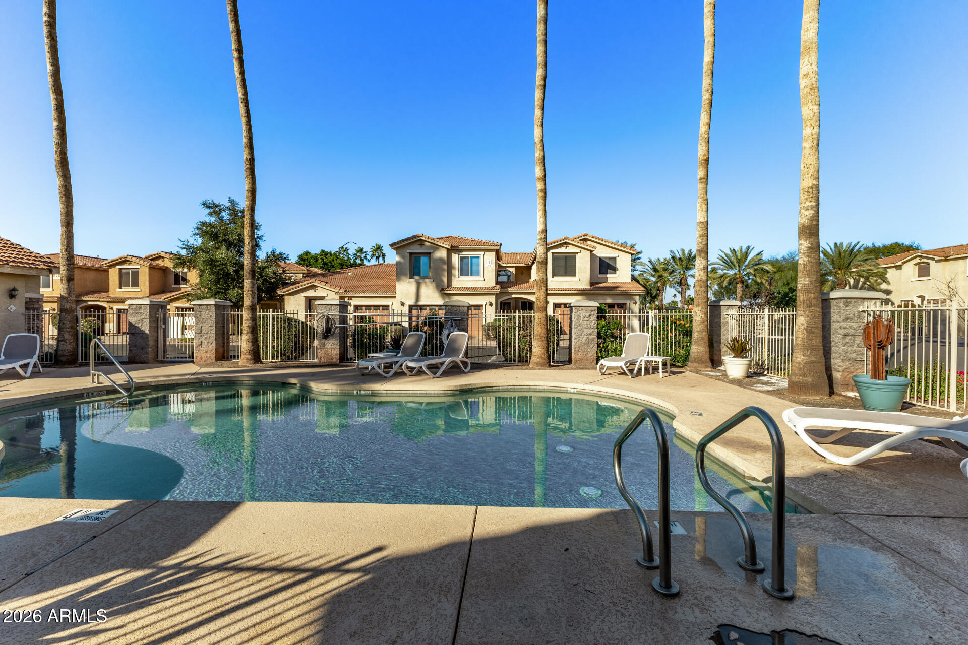 5415 East McKellips Road, Unit 106 Mesa, AZ 85215 - Photo 40 of 45 a view of swimming pool with outdoor seating