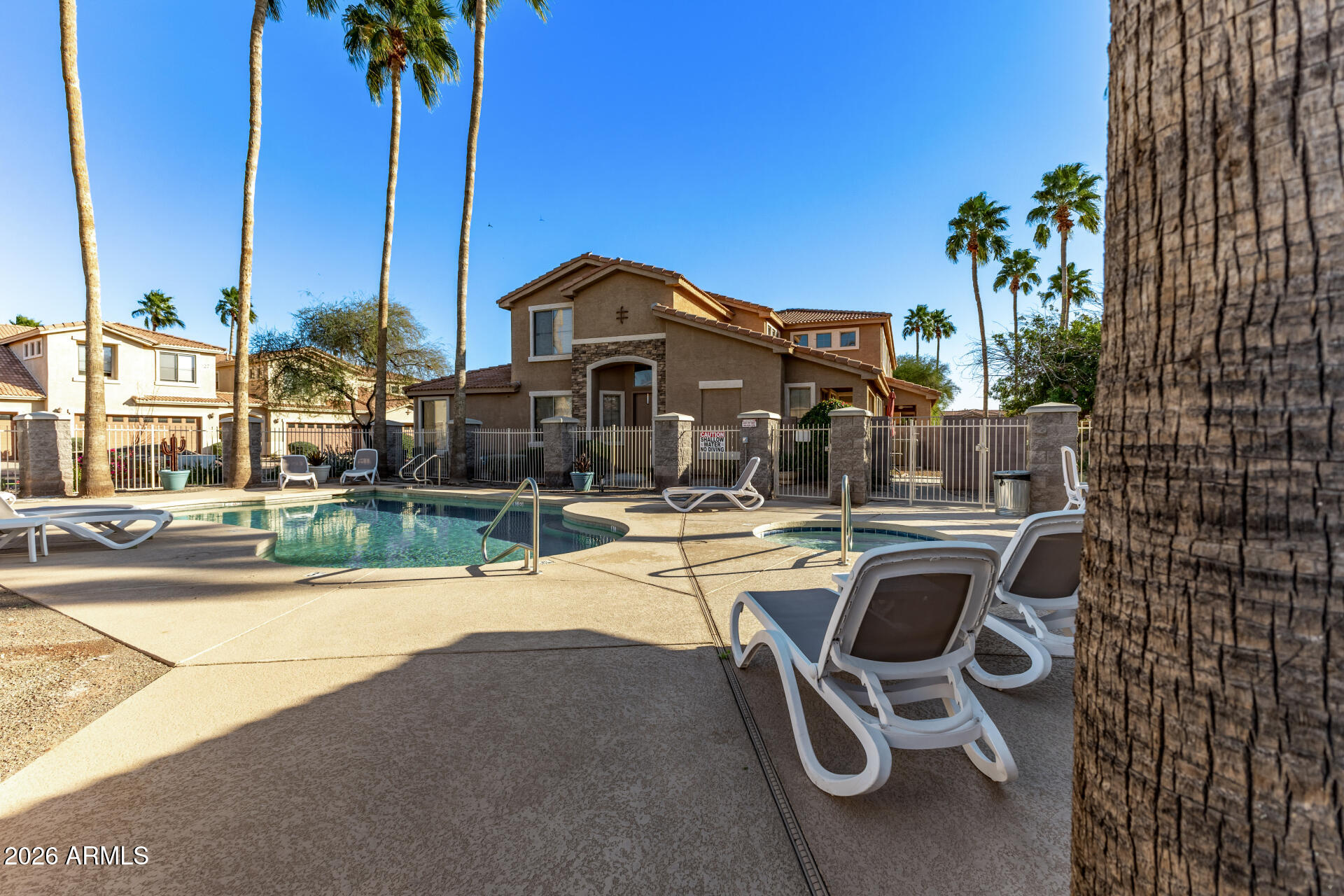 5415 East McKellips Road, Unit 106 Mesa, AZ 85215 - Photo 43 of 45 front view of a house with a swimming pool