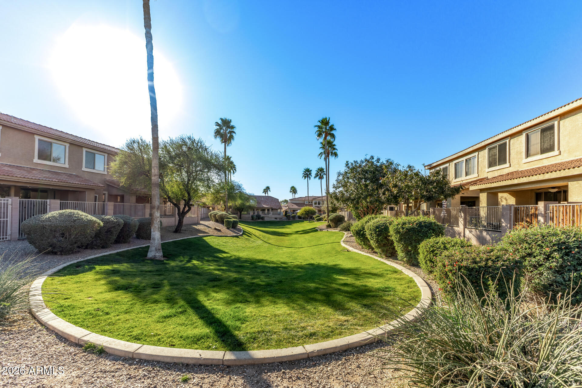 5415 East McKellips Road, Unit 106 Mesa, AZ 85215 - Photo 44 of 45 a view of a swimming pool with a yard and plants