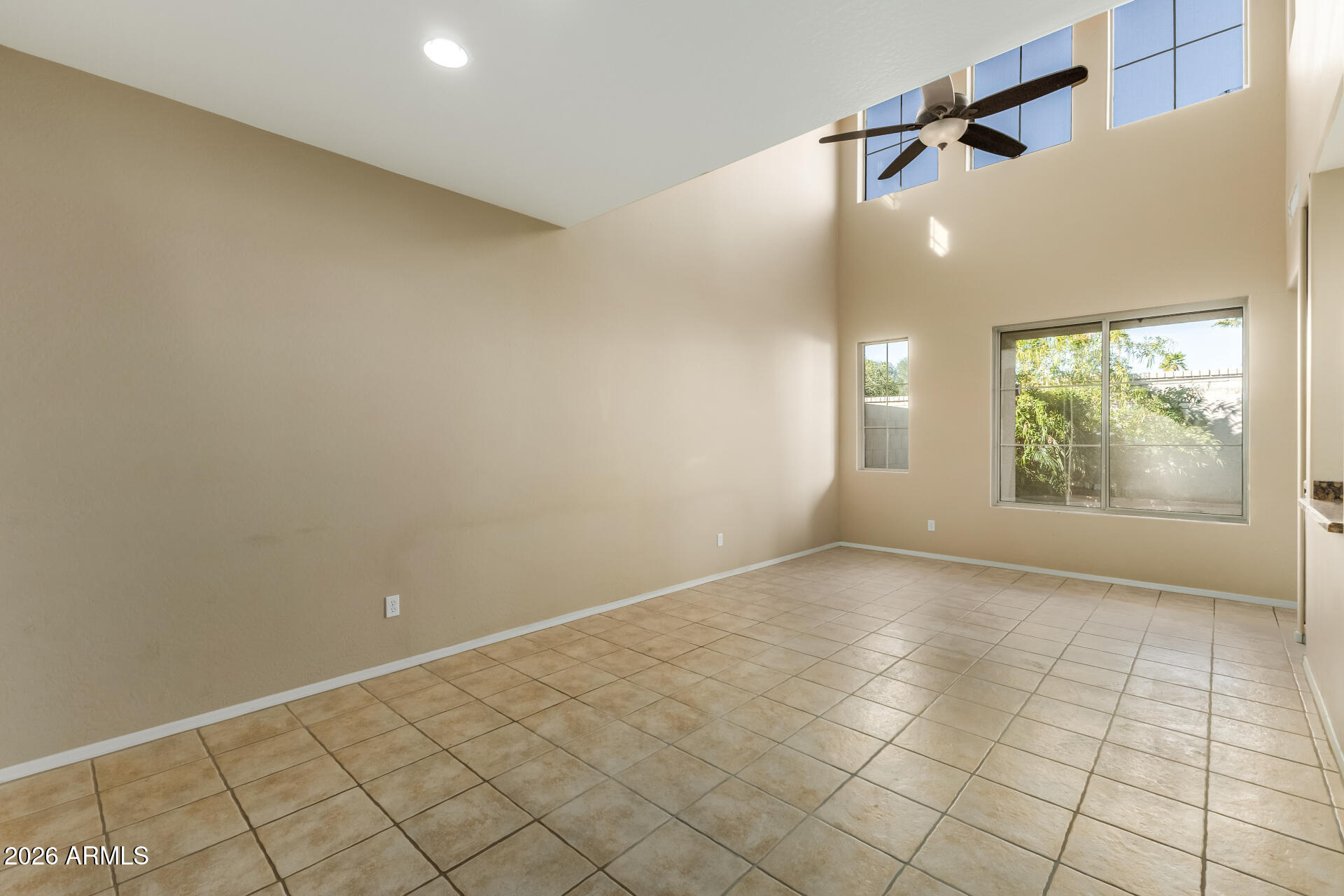 5415 East McKellips Road, Unit 106 Mesa, AZ 85215 - Photo 10 of 45 an empty room with windows and entrance