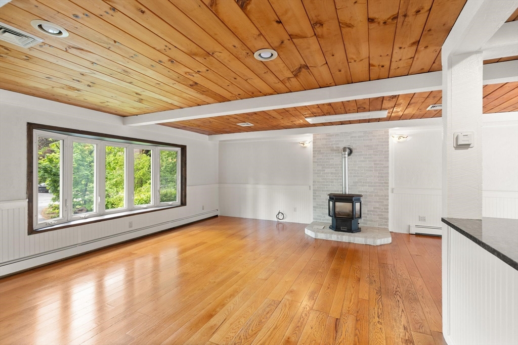 901 Haverhill Street Rowley, MA 01969 - Photo 8 of 42 a view of empty room with wooden floor and fan