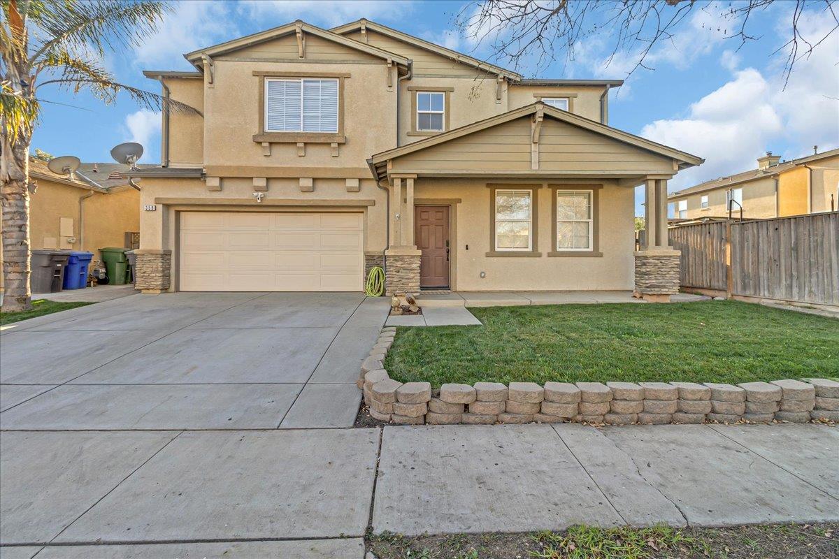 359 Barbera Way Greenfield, CA 93927 - Photo 1 of 1 a front view of a house with a yard and garage