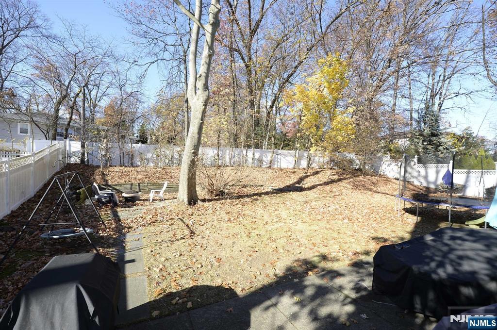 38-41 Taylor Road Fair Lawn, NJ 07410 - Photo 14 of 15 a view of a yard covered with snow