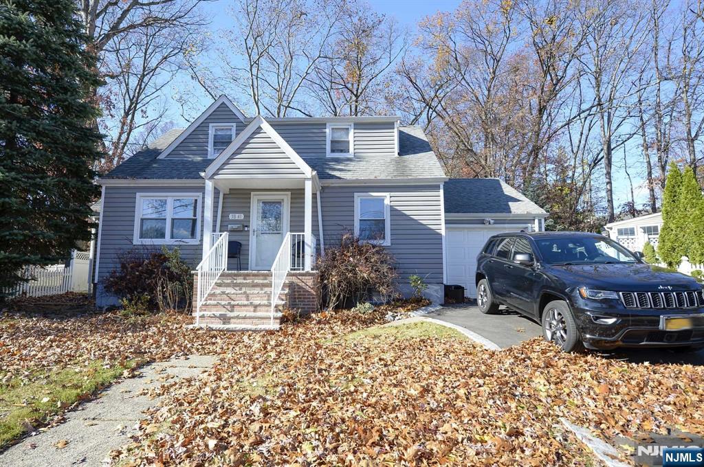 38-41 Taylor Road Fair Lawn, NJ 07410 - Photo 15 of 15 a front view of a house with a yard covered in snow