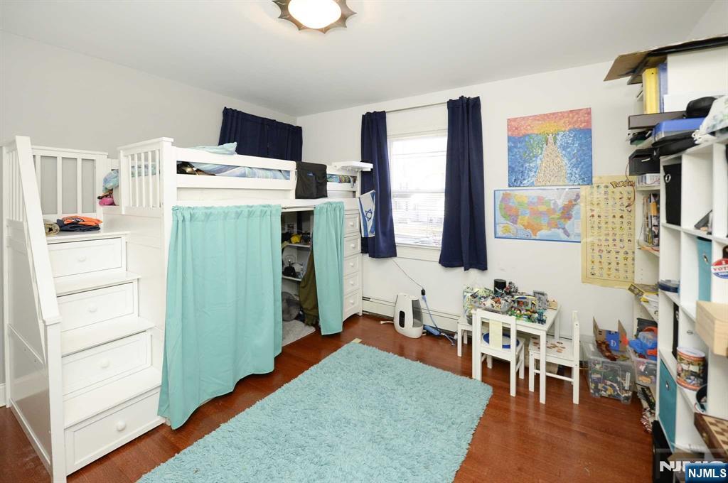 38-41 Taylor Road Fair Lawn, NJ 07410 - Photo 6 of 15 a living room with furniture and a table