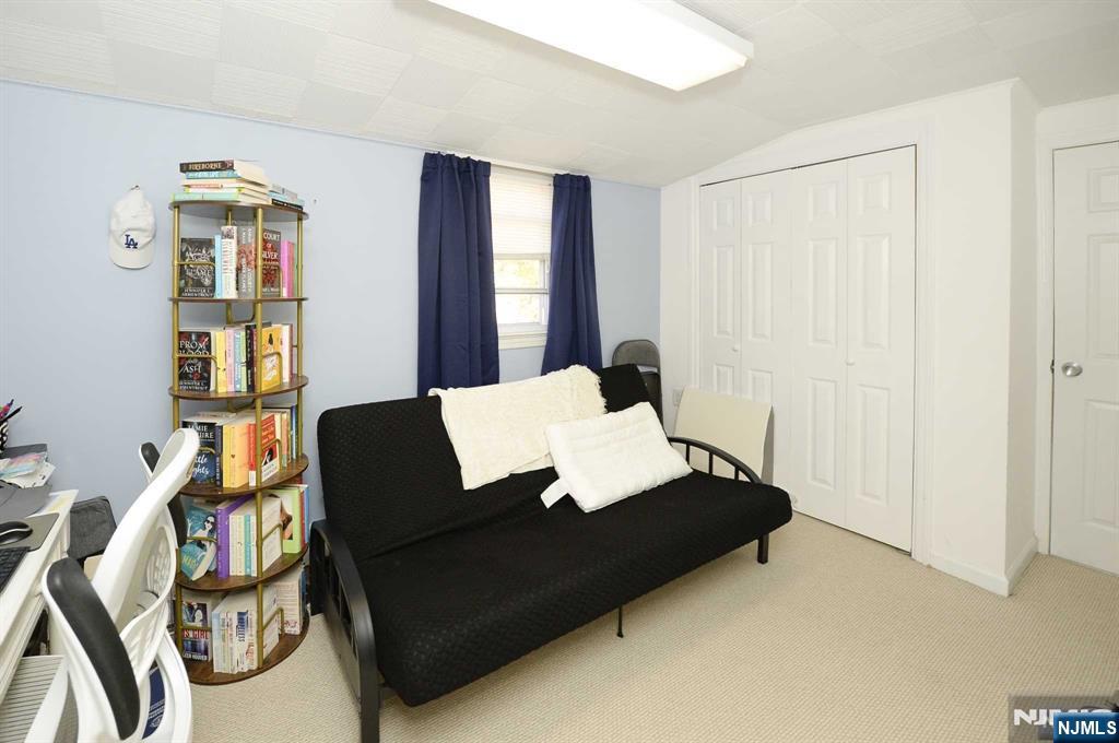 38-41 Taylor Road Fair Lawn, NJ 07410 - Photo 9 of 15 a living room with furniture and a window