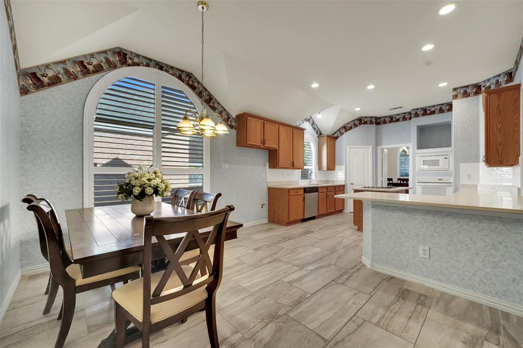 5409 Deer Brook Road Garland, TX 75044 - Photo 11 of 31 a dining room with kitchen island furniture and a kitchen view