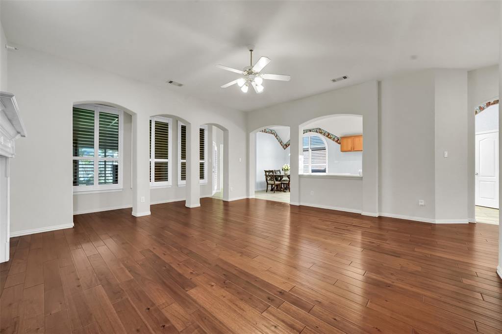 5409 Deer Brook Road Garland, TX 75044 - Photo 14 of 31 a view of empty room with wooden floor and fan