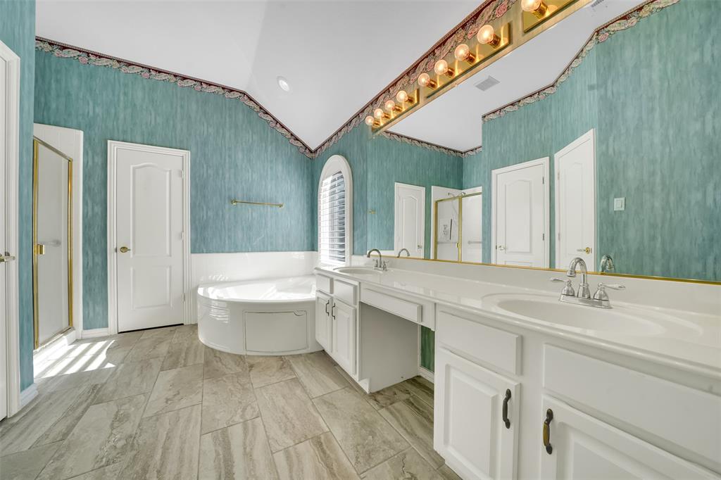 5409 Deer Brook Road Garland, TX 75044 - Photo 17 of 31 a bathroom with a sink and a mirror