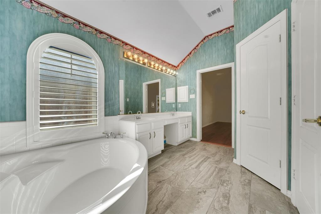 5409 Deer Brook Road Garland, TX 75044 - Photo 19 of 31 a view of spacious bathroom with a window