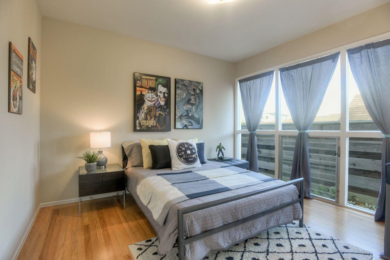 805 Robin Lane Millbrae, CA 94030 - Photo 17 of 23 a bedroom with a large bed and a window